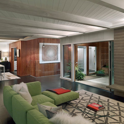 Inspiration for a large modern formal and open concept dark wood floor living room remodel in San Francisco with a concrete fireplace, a standard fireplace and no tv