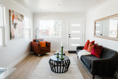 Example of a cottage chic living room design in Denver