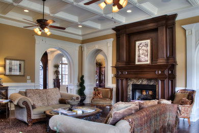 Example of a large classic formal and enclosed dark wood floor living room design in Other with brown walls, a two-sided fireplace and a tile fireplace