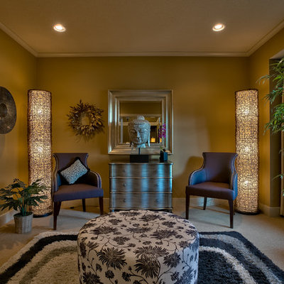 Example of a formal and enclosed carpeted living room design in Kansas City with brown walls and no fireplace