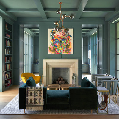 Living room library - mid-sized eclectic open concept medium tone wood floor and brown floor living room library idea in Dallas with green walls, a standard fireplace, a stone fireplace and no tv