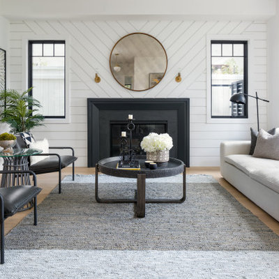 Example of a large transitional formal and open concept beige floor and shiplap wall living room design in Los Angeles with a standard fireplace, white walls, a metal fireplace and no tv