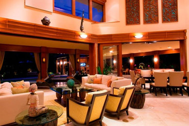 This is an example of a large open plan living room in Hawaii with beige walls.