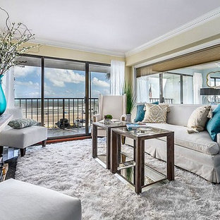 Example of a small transitional open concept marble floor and black floor living room design in Houston with brown walls and a tv stand
