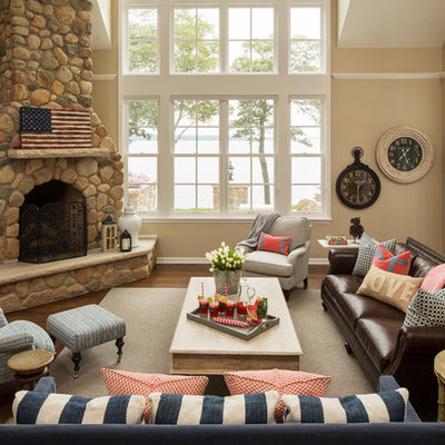 Elegant open concept and formal dark wood floor living room photo in Minneapolis with beige walls, a corner fireplace, a stone fireplace and a wall-mounted tv