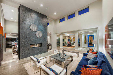 Inspiration for a large contemporary formal and open concept light wood floor and brown floor living room remodel in San Diego with white walls, a two-sided fireplace, a tile fireplace and no tv