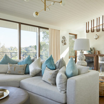 Large 1960s open concept medium tone wood floor and shiplap ceiling living room photo in Los Angeles with white walls, no fireplace and a wall-mounted tv