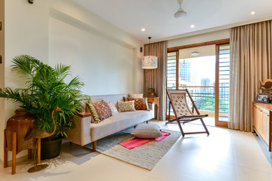 Living room - coastal living room idea in Mumbai
