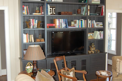 Living room - transitional living room idea in Charlotte with a media wall