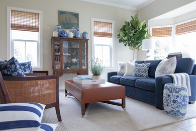 Example of a classic open concept ceramic tile living room design in New York with beige walls