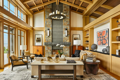 Living room - large transitional open concept medium tone wood floor, exposed beam, vaulted ceiling, wood ceiling and brown floor living room idea in Seattle with a stone fireplace, no tv, beige walls and a standard fireplace