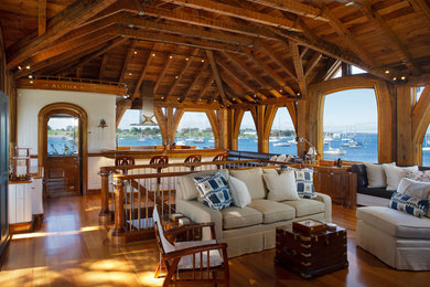 Photo of a medium sized beach style open plan living room in Providence with medium hardwood flooring, a home bar and brown walls.