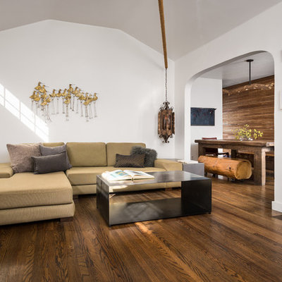 Living room - small contemporary open concept medium tone wood floor and brown floor living room idea in Los Angeles with white walls, a standard fireplace, a plaster fireplace and no tv