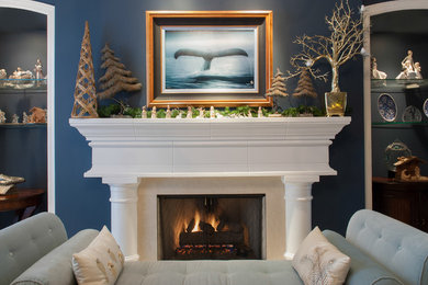 Living room - traditional carpeted living room idea in St Louis with blue walls, a standard fireplace and a stone fireplace