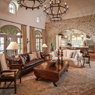 Mid-sized tuscan formal and enclosed terra-cotta tile and red floor living room photo in Houston with beige walls, no fireplace and no tv