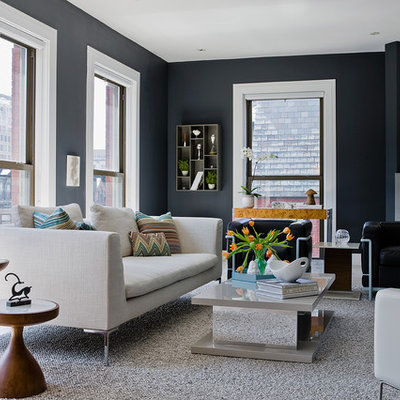 Example of a mid-sized transitional formal and enclosed light wood floor living room design in Boston with no tv, a concrete fireplace, gray walls and a standard fireplace
