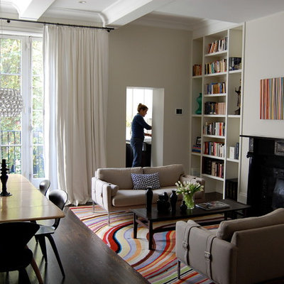 Inspiration for a modern open concept living room remodel in Boston with beige walls and a standard fireplace