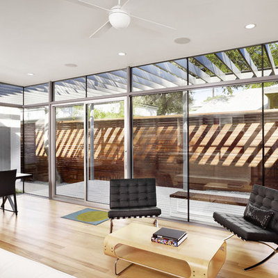 Inspiration for a modern light wood floor living room remodel in Austin