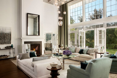 Inspiration for a large traditional formal open plan living room in San Diego with white walls, dark hardwood flooring, a standard fireplace, a metal fireplace surround, no tv and brown floors.