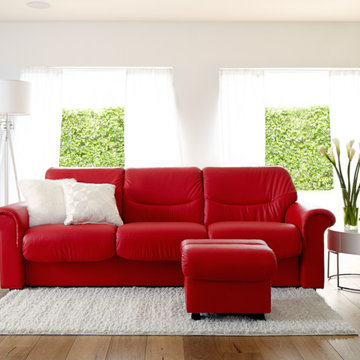 Bright and Airy Living Room With Red Leather Couch