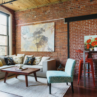 Inspiration for an industrial open concept dark wood floor living room remodel in New York with red walls