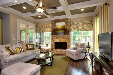 Example of a mid-sized classic formal and enclosed dark wood floor living room design in Atlanta with beige walls, a standard fireplace, a stone fireplace and a tv stand
