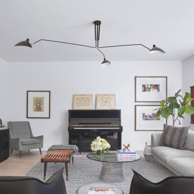 Inspiration for a small contemporary light wood floor and beige floor living room remodel in Austin with white walls and a wall-mounted tv