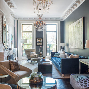 Mid-sized eclectic open concept dark wood floor and black floor living room photo in New York with gray walls, a standard fireplace, a brick fireplace and no tv