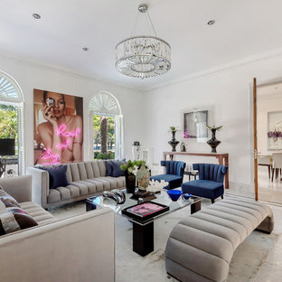 Bohemian formal enclosed living room in Hertfordshire with white walls, marble flooring and white floors.