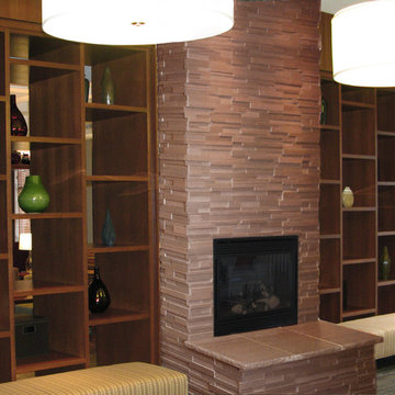 Brown Stone Firepalce with Built In Cabinets