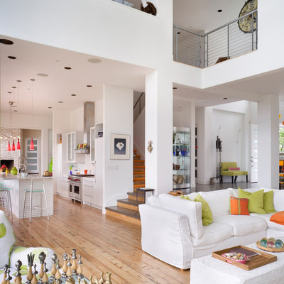 Trendy open concept beige floor living room photo in Portland with white walls