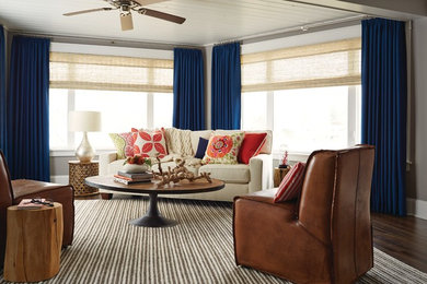 Example of a mid-sized eclectic open concept carpeted living room design in Cleveland with blue walls and no fireplace