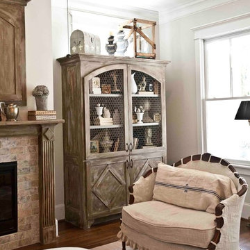 Built-in Antiqued Cabinetry and French Settee with Linen Slipcover