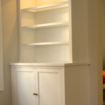 Built-in cabinets and bookshelves.