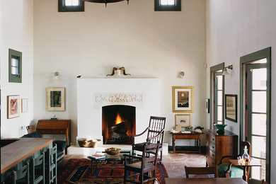 Country open concept living room photo in Austin with white walls, a standard fireplace and no tv