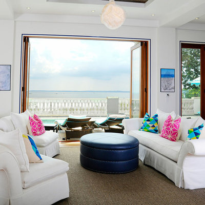 Living room - large coastal open concept and formal medium tone wood floor living room idea in New York with white walls, no fireplace and no tv