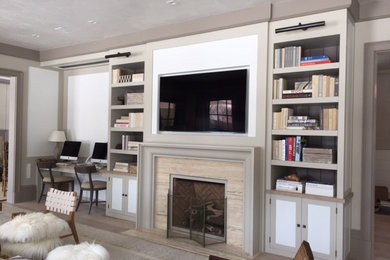 Example of a mid-sized transitional enclosed light wood floor and beige floor living room design in New York with white walls, a standard fireplace, a tile fireplace and a wall-mounted tv