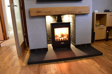 Caithness flagstone brushed riven hearth with matt polished tiles