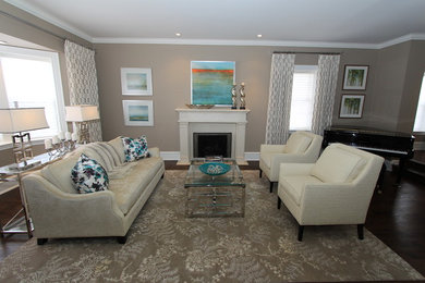 Example of a huge trendy formal and open concept dark wood floor living room design in Toronto with beige walls, a standard fireplace and a plaster fireplace