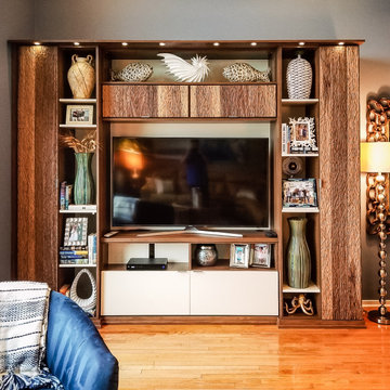 California Closets custom entertainment unit with textured walnut and lighting