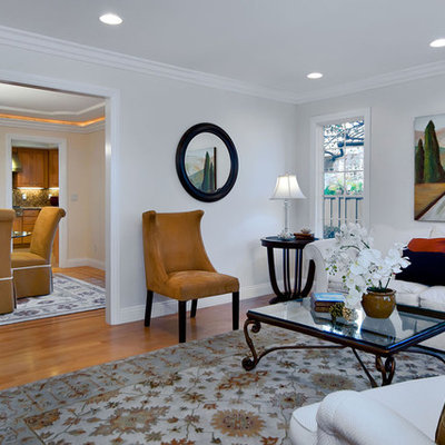 Living room - contemporary medium tone wood floor living room idea in San Francisco with white walls