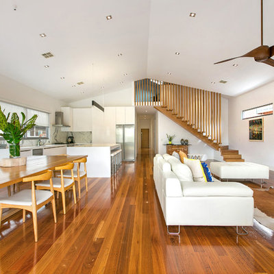 Living room - mid-sized contemporary open concept medium tone wood floor living room idea in Melbourne with white walls