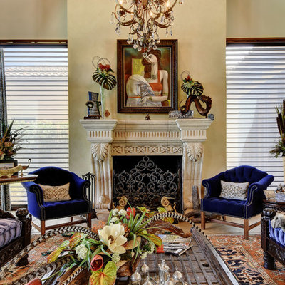 Living room - mediterranean formal and open concept living room idea in Austin with beige walls and a standard fireplace