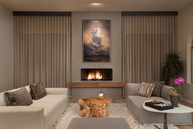 Réalisation d'un grand salon design ouvert avec parquet clair, une cheminée ribbon, un manteau de cheminée en plâtre, un mur gris et un sol marron.