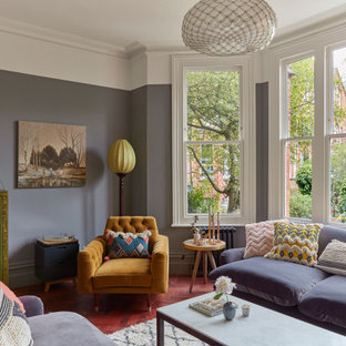 Photo of a victorian living room in London with medium hardwood flooring and multi-coloured walls.