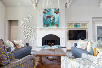 Inspiration for a mid-sized coastal open concept dark wood floor living room remodel in Other with gray walls, a standard fireplace and a media wall