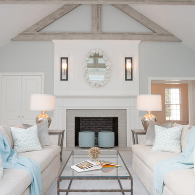 Beach style formal living room photo in Boston with gray walls, a standard fireplace and a brick fireplace