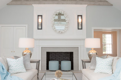 Beach style formal living room photo in Boston with gray walls, a standard fireplace and a brick fireplace