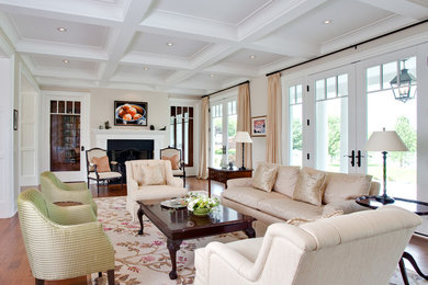 Living room - traditional formal and open concept medium tone wood floor living room idea in Ottawa with white walls, a standard fireplace, a wood fireplace surround and no tv