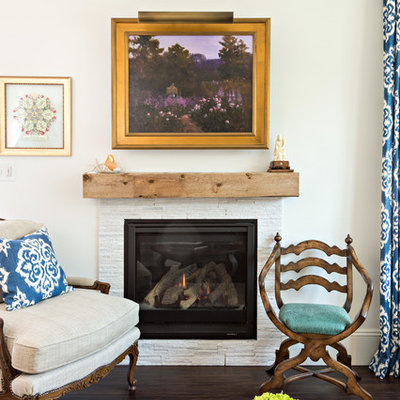 Living room library - mid-sized traditional enclosed vinyl floor living room library idea in Boston with white walls, a standard fireplace, a stone fireplace and no tv